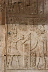 Hieroglyphic carvings on the exterior walls of  egyptian temple