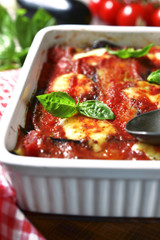 Traditional italian dish parmigiana with eggplants.