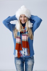 Happy woman posing in winter clothes