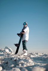 snowboarder standing on the top of the mountain
