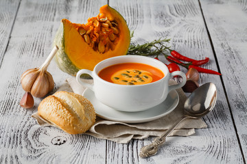 Pumpkin soup on a wooden table
