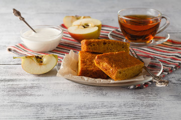 Cup of apple tea on a glass plate