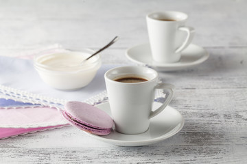 Two Cups of coffee serving on shabby chic background