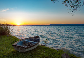Beautiful sunset over Lake Balaton with a boat in the front