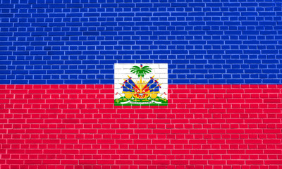 Flag of Haiti on brick wall texture background