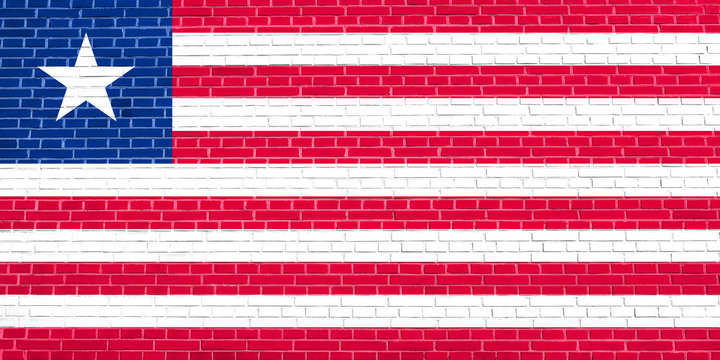Flag of Liberia on brick wall texture background