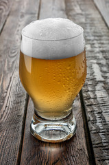 Glass beer on wood table