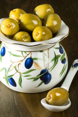 green olives in porcelain vase