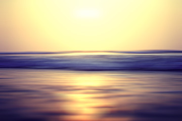 Obraz premium blurred background sunset on the sea