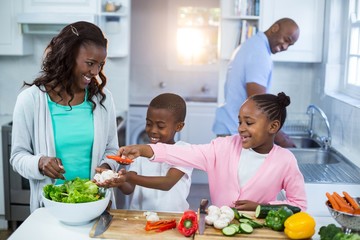 Happy family preparing food