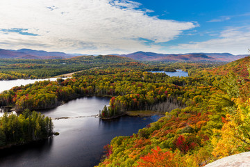 Autumn beginning to take affect on cottage country in the Quebec north. Trees turning blood red before the winter onslaught.