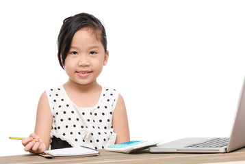 cute student girl writing homework with laptop computer
