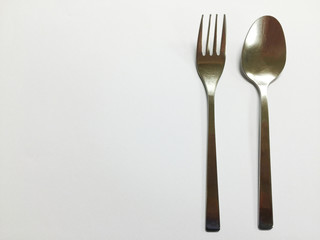 Silver spoon and flog on white background copy space