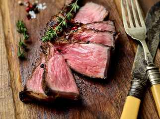 sliced grilled lamb steak on a cutting board