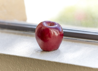 Red Apple on Kitchen Window Sill