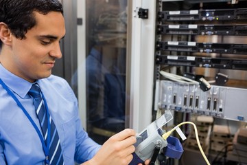 Technician using digital cable analyzer