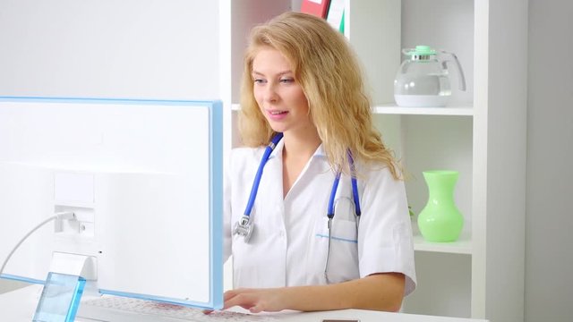 Medical doctor woman working on computer,