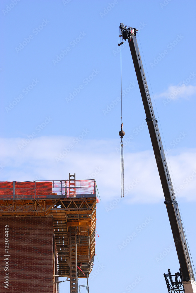 Wall mural crane at building construction site