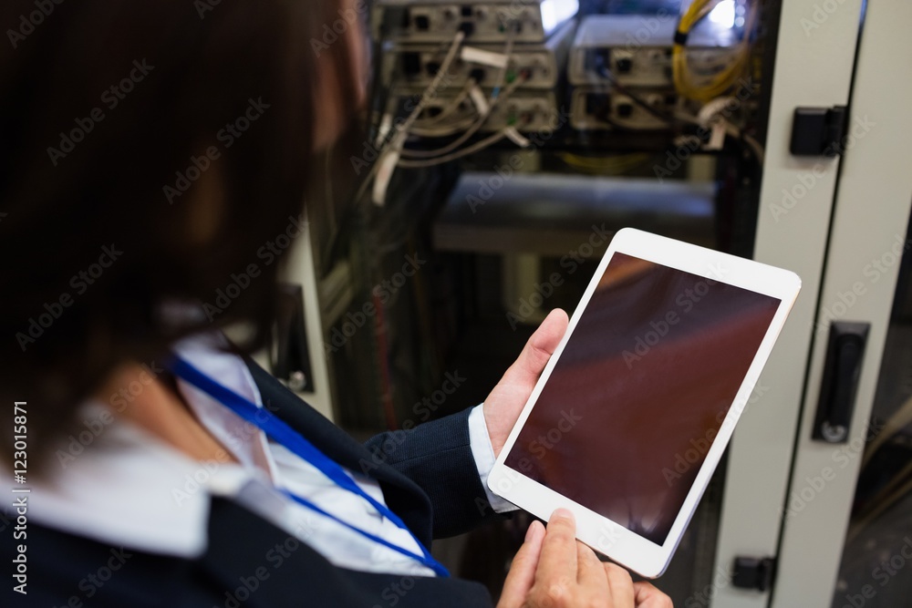 Aufkleber technician using digital tablet
