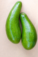 Pair of raw avocados lay on gray background. Yin yang harmony