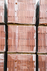 Pallets of bricks wrapped in plastic