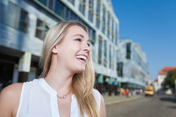 Fototapeta premium business woman laughing to copy space in blue sky