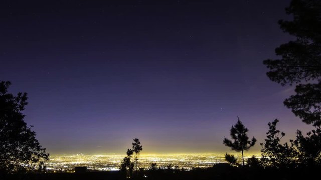 Time lapse with zoom in motion of Los Angeles aerial cityscape overlook at night