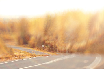 background blur road autumn sunbeams glare