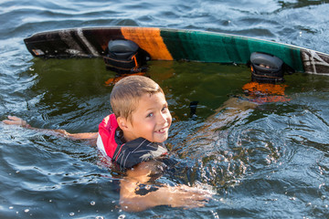 Young Boy learning to Wakeboard - 123017856