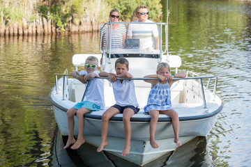 family hanging out together in a boat
