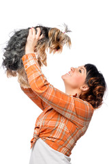 Happy girl playing with her dog isolated