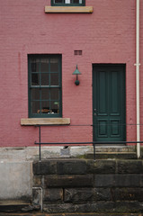 Fototapeta na wymiar Pinky cherry colour brick townhouse in London