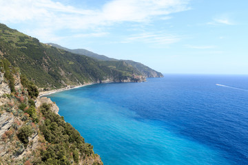 Fototapeta premium Rocky coast and Cinque Terre village Manarola and Mediterranean Sea, Italy
