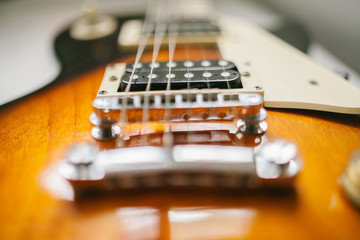 Fototapeta na wymiar Part of Electrical guitar body close up.Focused detailing button,in film and grain tone