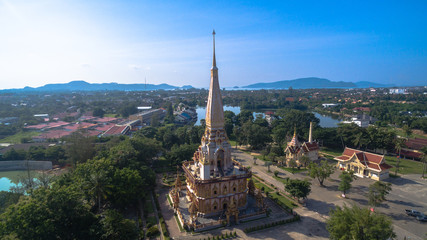Fototapeta na wymiar aerial view pagoda of Chalong temple Phuket Thailand this temple know well for tourist The Grand Pagoda dominating the temple contains a splinter of Lord Buddha's bone and is officially