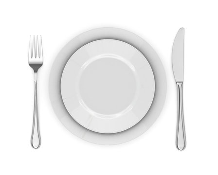Dinner place setting. A white plate with silver fork and spoon i