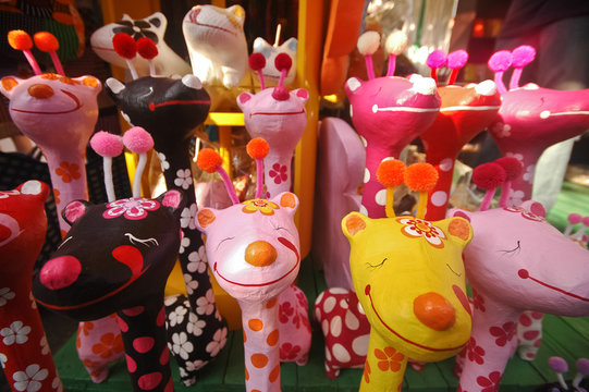 Colourful happy giraffe wooden doll in Thailand