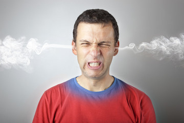 Stress and anger, angry upset man with head pressure and smoke coming out from his head