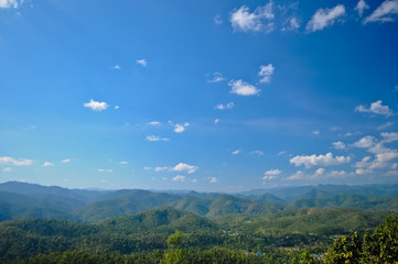 Scenic giant green valley and blue sky in bright Summer day