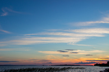 Beautiful tranquil summer sunset on the Onega lake, Karelia, Russia