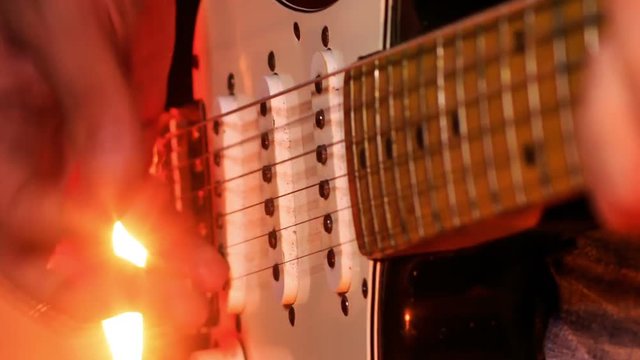 Closeup Guitarist Plays Electric Guitar in Night Bar
