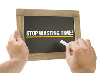 Stop wasting Time! Hand writing on chalkboard