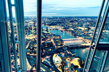 Fototapeta na wymiar Magnificent night aerial view of London Bridges from a city wind