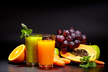 Glasses with fresh organic vegetable and fruit juices isolated 