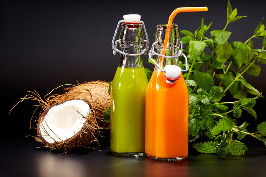 Glasses with fresh organic vegetable and fruit juices isolated 