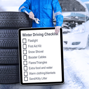 Mechanic With Tires And Winter Driving Tips