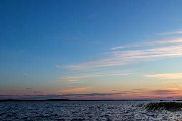 Fototapeta na wymiar Beautiful tranquil summer sunset on the Onega lake, Karelia, Russia