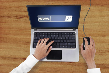 Worker hand with laptop and www text