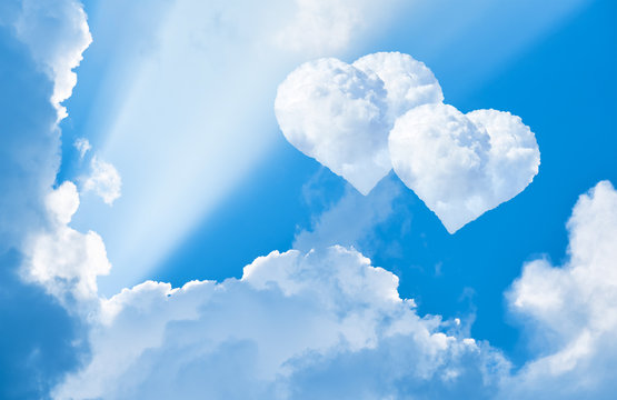 Two clouds in the shape of heart in the sky