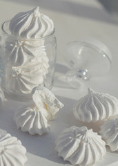 Close-up shot of white meringues on a white background